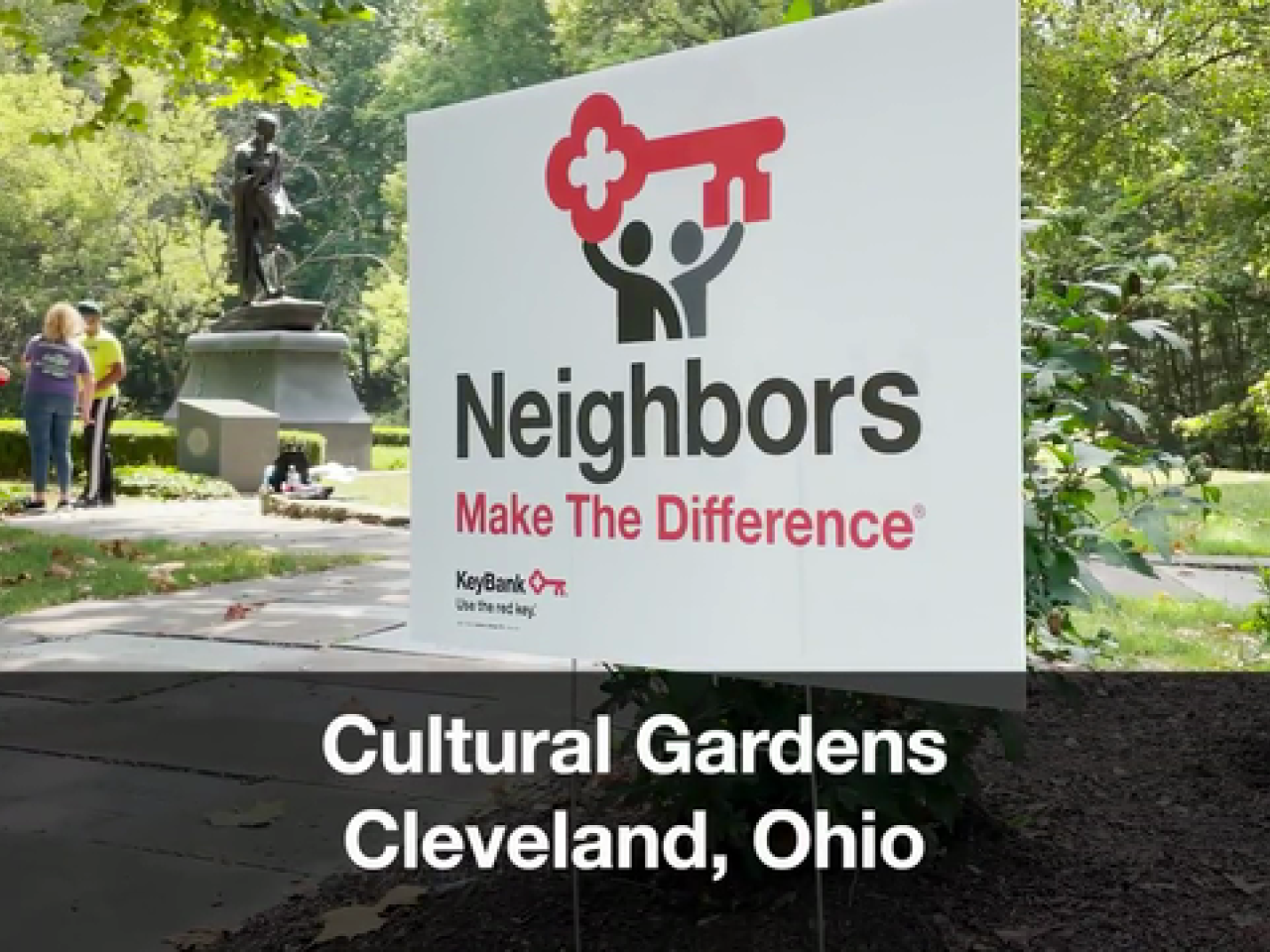 Sign in park reading, "Neighbors Make The Difference"