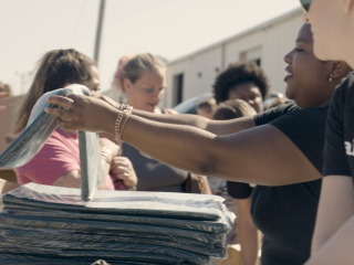 Volunteers handing out packages