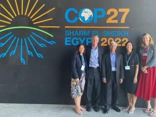 group photo in front of COP27 sign