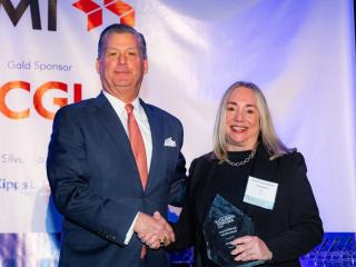 CACI’s Linda Braun, Ph.D. accepting an award