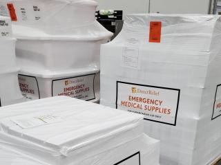 Stacks of wrapped pallets, "DirectRelief Emergency Medical Supplies" on the sides