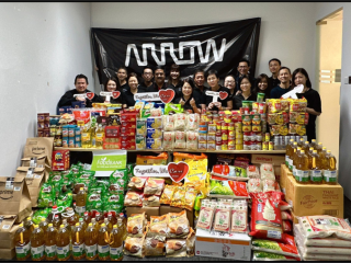 Arrow employees helping at a food bank in Singapore