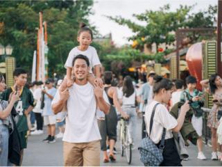 Man with a child on his shoulders.
