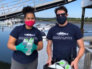 Research Scientist Tim O'Donnell teaches Gloucester Biotechnology Academy student Tamia Buckley proper water sampling techniques during her internship at GMGI.