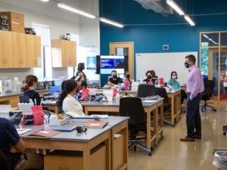 Education Director John Doyle, PhD, instructs Gloucester Biotechnology Academy students directly from the lab bench, allowing more time for hands-on learning.