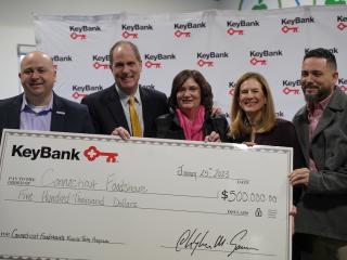 KeyBank and Conn Foodshare team with grant check.