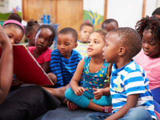young children sitting together for story time