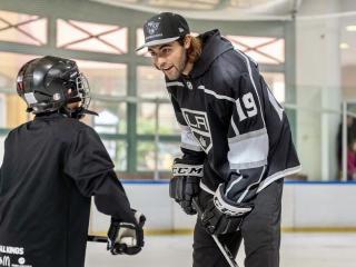 LA Kings Alex Iafallo talking to child during LA Kings “We Are All Kings” Rink Tour  