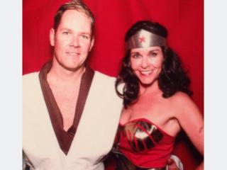 Erica Opstad dressed as Wonder Woman for a Halloween party and her husband Keith.