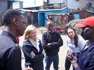 Laura Kohler talking to group on a Nairobi street