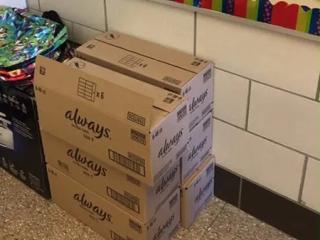 stacks of boxes marked "always" in a school room