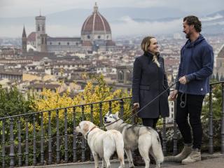 Stefanie and Steve walking their two dogs in Florence, Italy