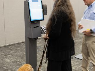 person at Self-Ordering Kiosk