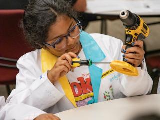 Woman using DeWalt drill