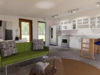 Interior of the 3D printed home. Open concept kitchen, living room, dining room in the same space.