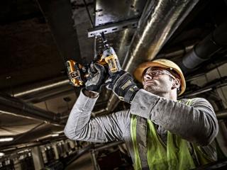 Man using DeWalt drill