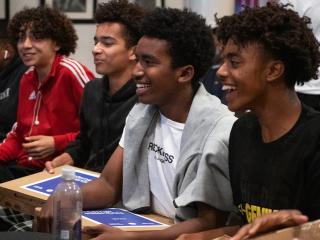 Young men from the Hidden Genius Project in Oakland receiving their free personal laptops.