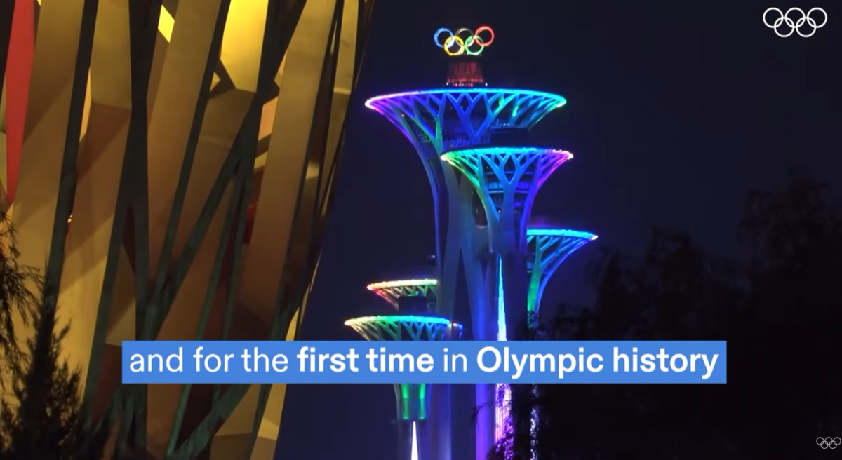Buildings lit up with olympic rings