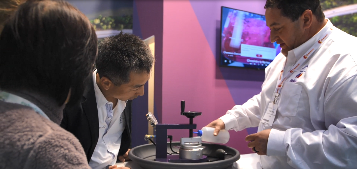 A Chemours employee demonstrating Nafion at a convention.