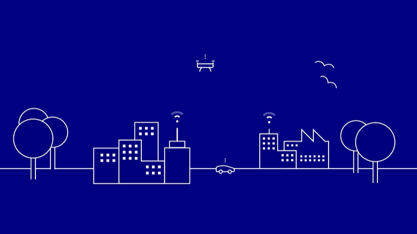 White line graphic on bluebackground of a city, with connection towers on buildings, cars, and drones.