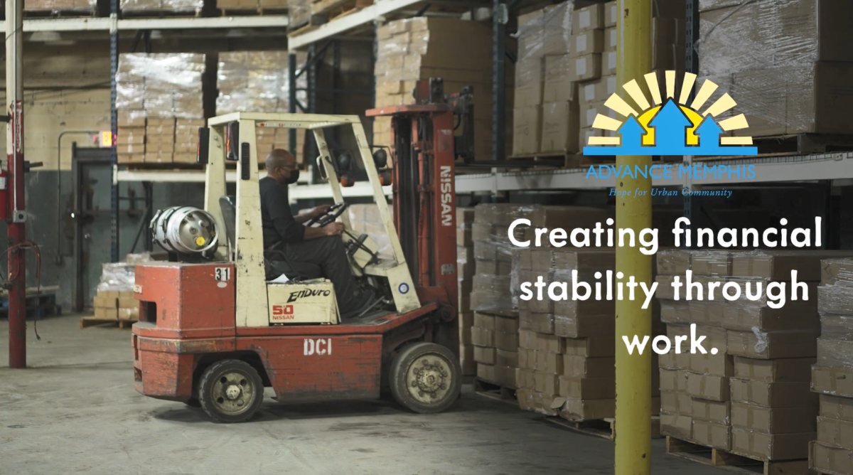 A person operating a forklift in a warehouse.