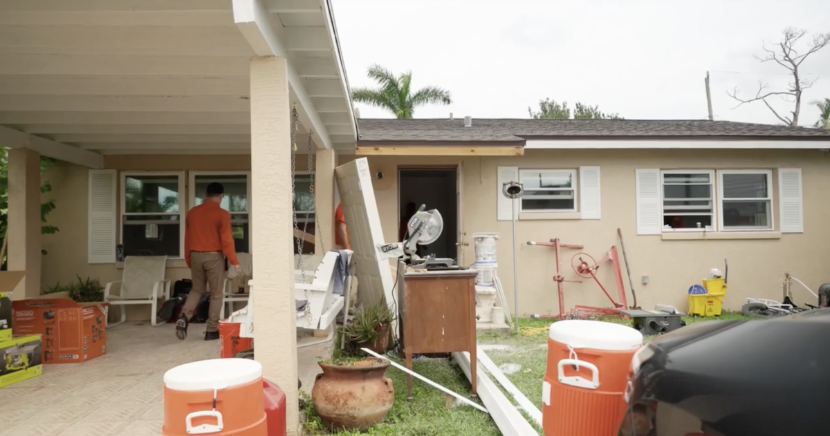 volunteers walking in to a house 