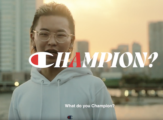 Champion: What do you champion. Photo of a young designer in front of a city scape.