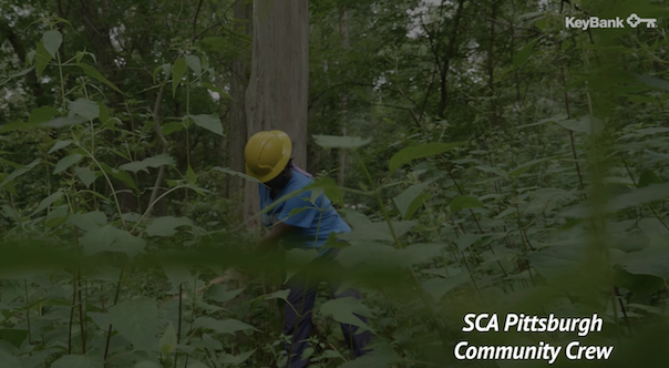 KeyBank SCA Pittsburgh community crew member working in a green space.