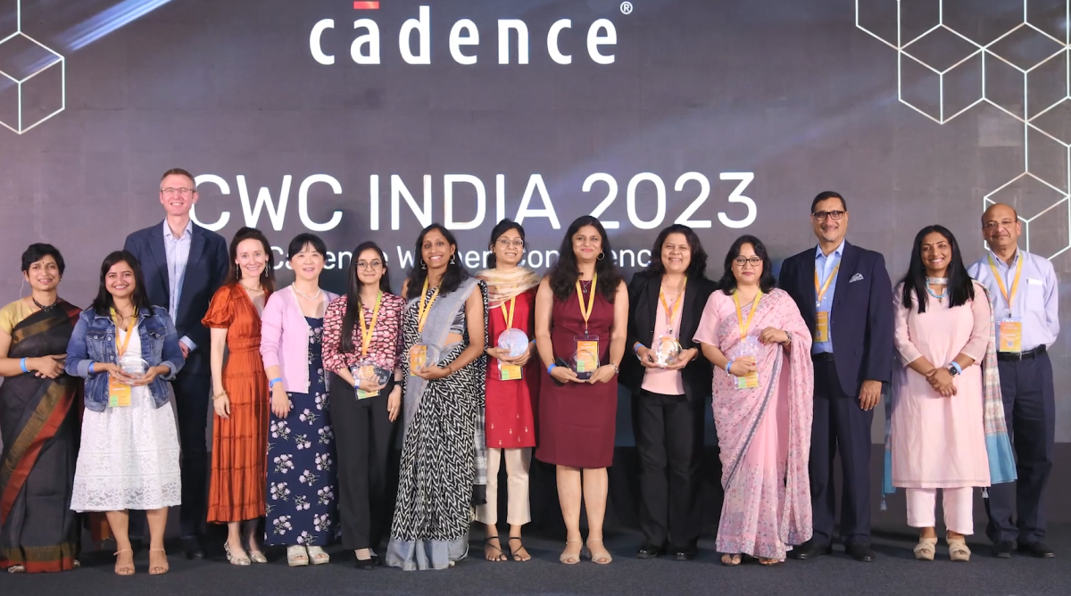 A group of people on a stage, many holding awards "CWC India 2023" behind them.