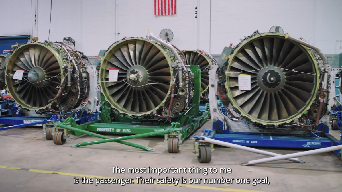 A row of airplane engines on trollies.