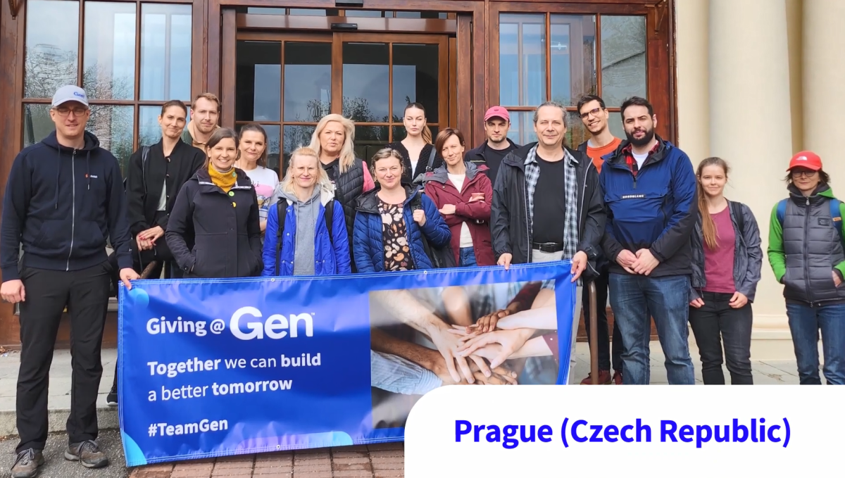 A group posed outside a building, holding a banner "Giving at Gen. Together we can build a better tomorrow."