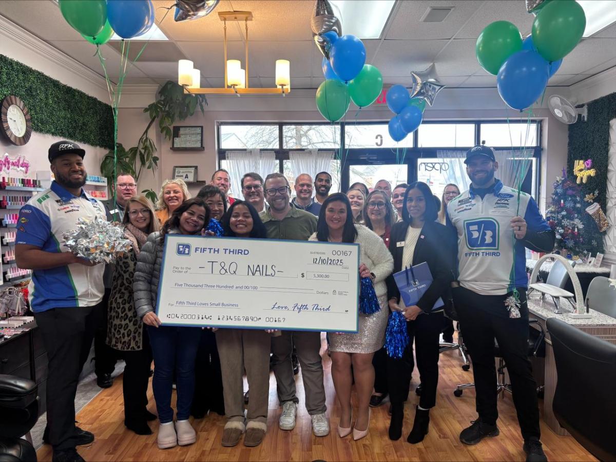 T&Q Nails receiving grant check from Fifth Third