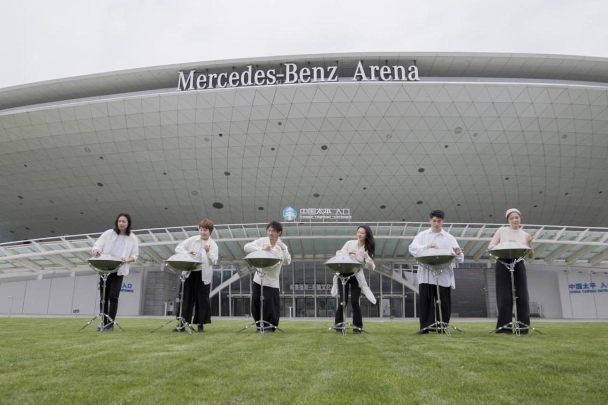 Aether band performs in front of Mercedes-Benz Arena Shanghai.