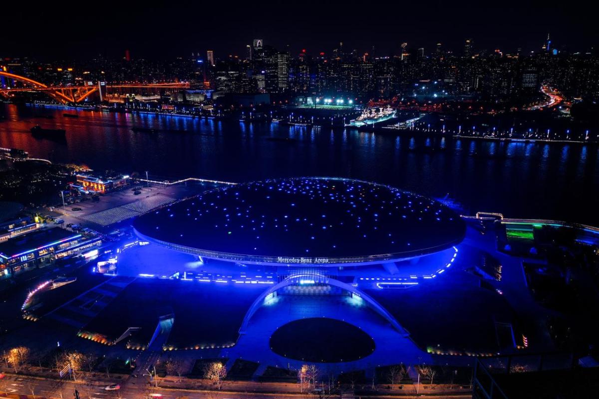 Mercedes-Benz Arena Shanghai illuminated blue for Earth Day 2023.