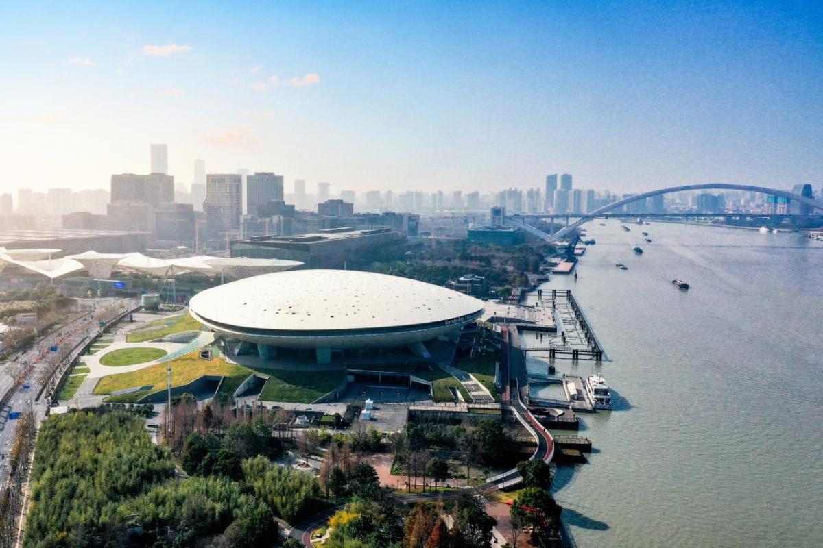 Aerial view of the Mercedes-Benz Arena Shanghai beside the Huangpu River.