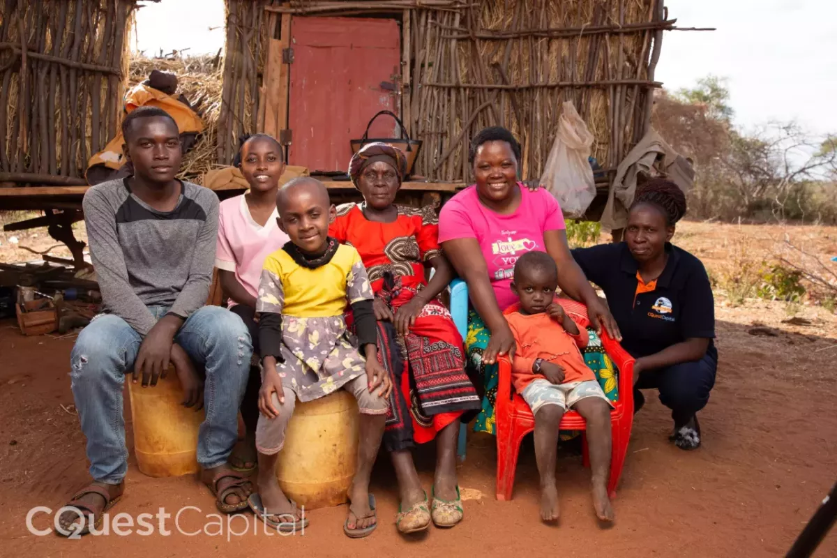 Joyce with her family and C-Quest Capital field officer. Image credits: C-Quest Capital