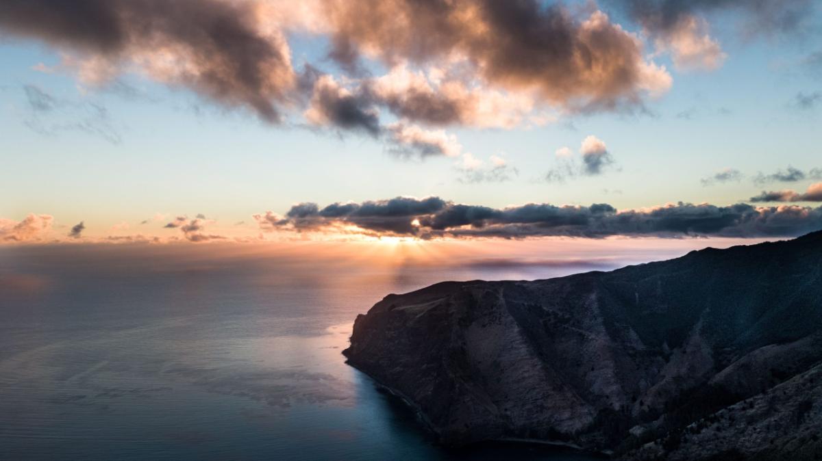 sunrise along a rocky coastline