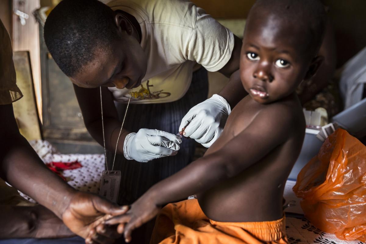 Community health worker with child