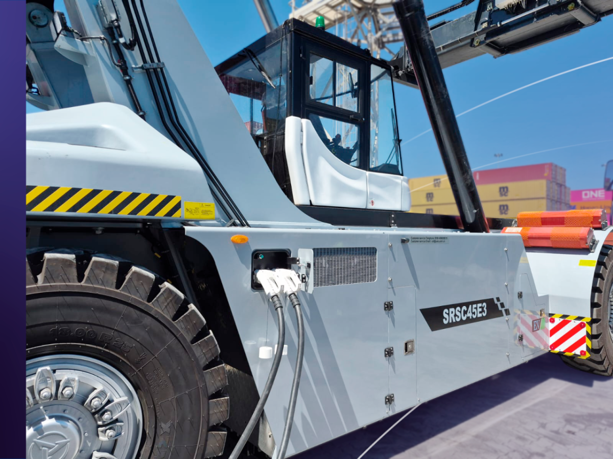 Close-up of electric charging cables connected to SANY SRSC45E3 Reach Stacker at DP World Lirquén terminal.
