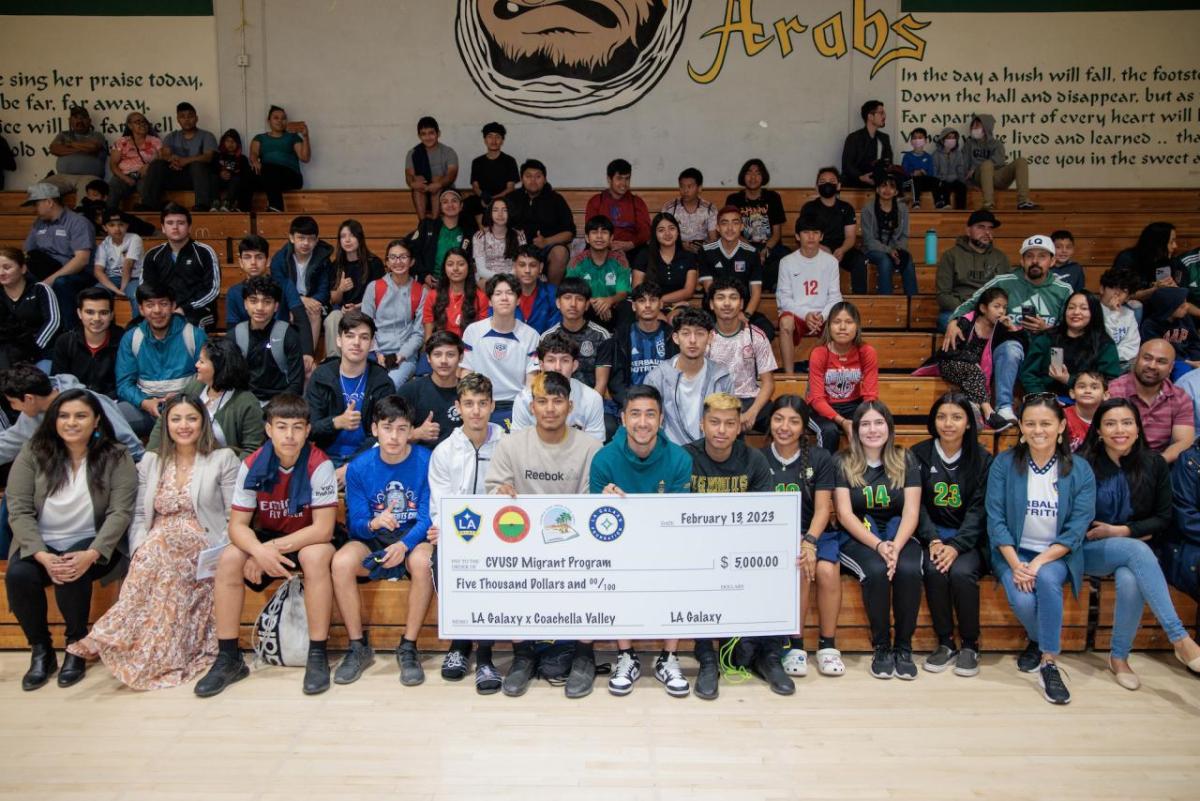 LA Galaxy's Jose “Memo” Rodriguez poses with migrant student athletes from CVUSD.