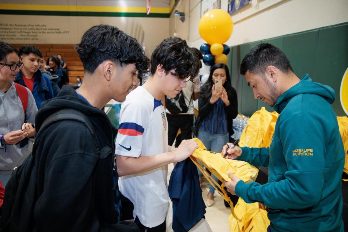 LA Galaxy's Jose “Memo” Rodriguez passes out LA Galaxy backpacks to students in Coachella Valley.