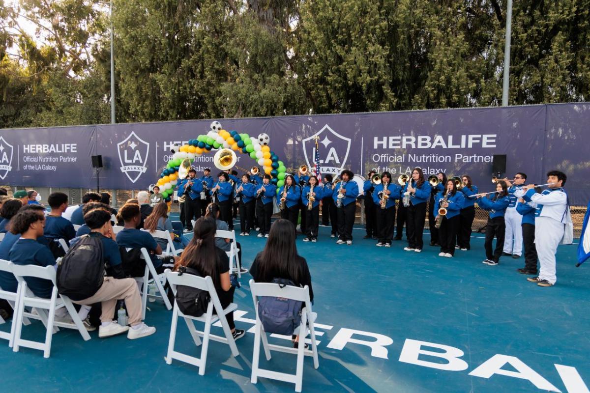 Students from Jordan High School's marching band performed at the ceremony.