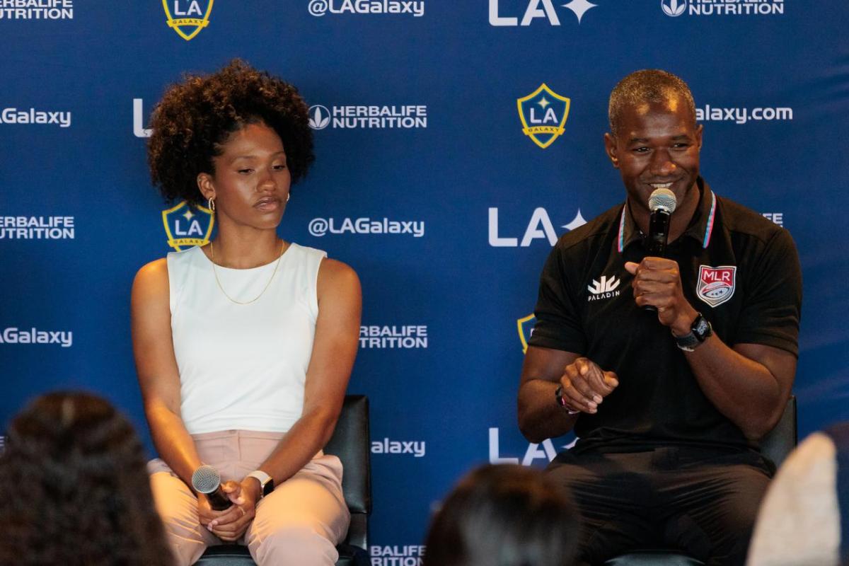 Denecia Fernandes and Marquise Goodwin answering a student's questions during the panel.