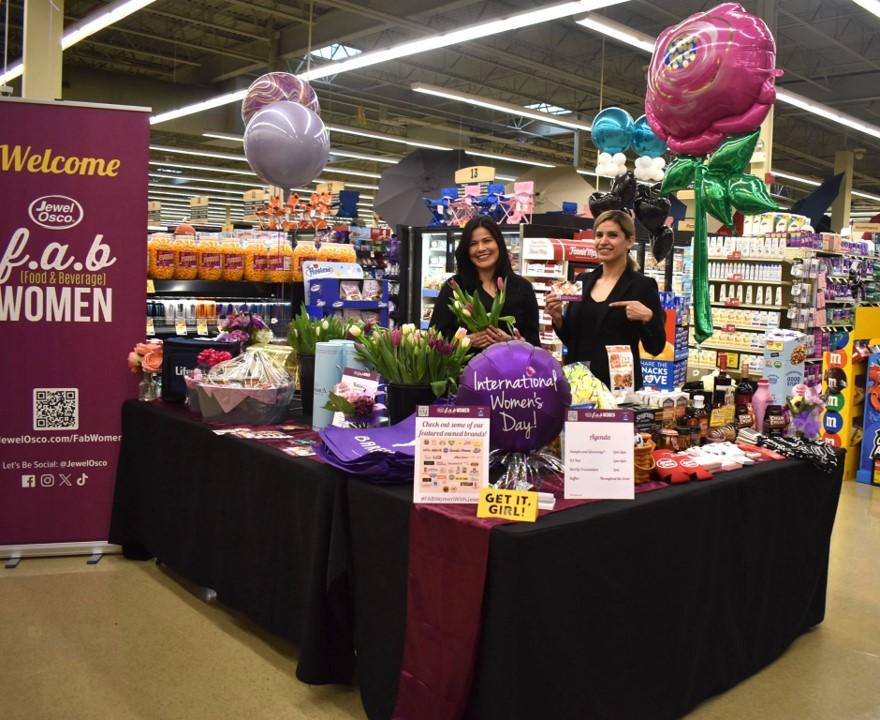 People posing at booths at Jewel-Osco's FABulous event