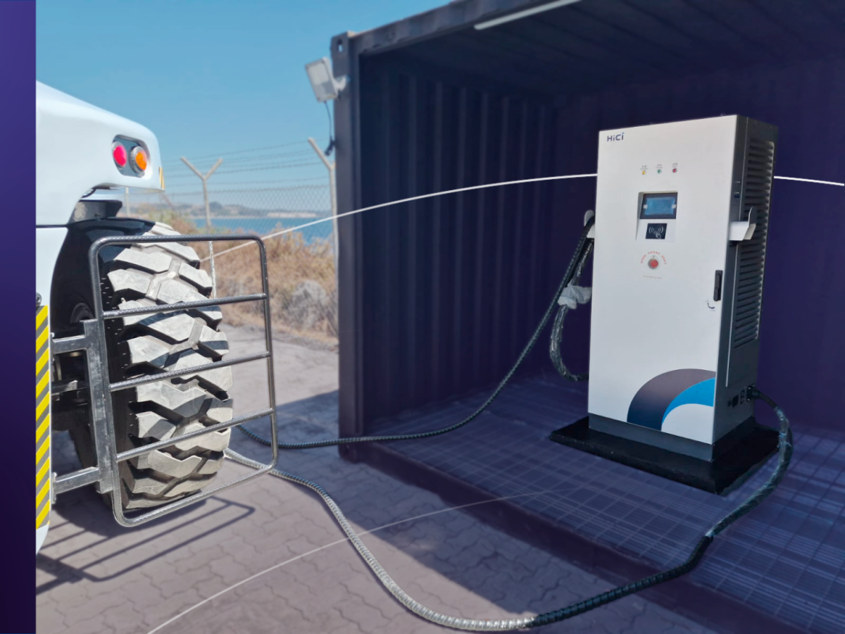 Electric vehicle charging unit connected to heavy port equipment at DP World Lirquén terminal in Chile.