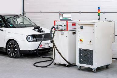 Keysight’s SL1202A Scienlab Regenerative AC Emulator (right) with SL1040A Scienlab Charging Discovery System (middle) testing an EV’s onboard charger (left)
