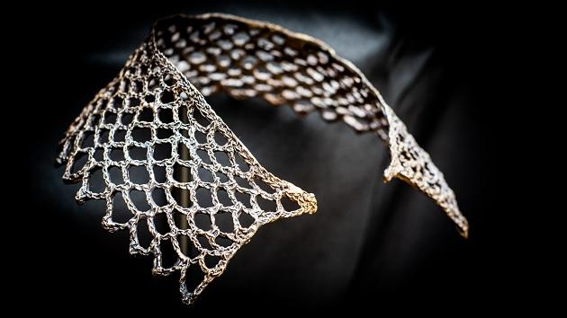 Ruth Bader Ginsberg's iconic lace collar, cast in bronze, is part of the Woman, the Spirit of the Universe exhibit created by artist Carolyn Marks Johnson, and on display at Holocaust Museum Houston. Photo by Sonya Cuellar. Ruth Bader Ginsberg’s iconic lace collar, cast in bronze