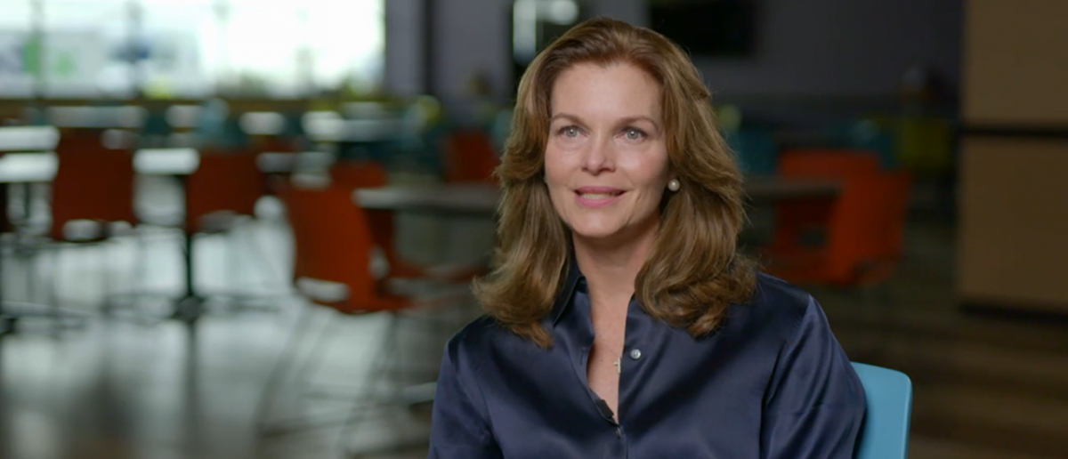 Photo of a woman in a navy blue blouse