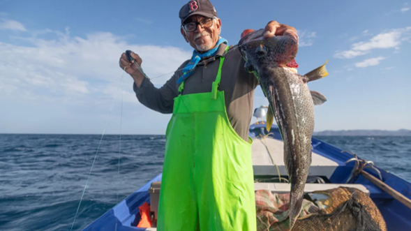 Photo courtesy of Conservation Alliance for Seafood Solutions A person holding a fish