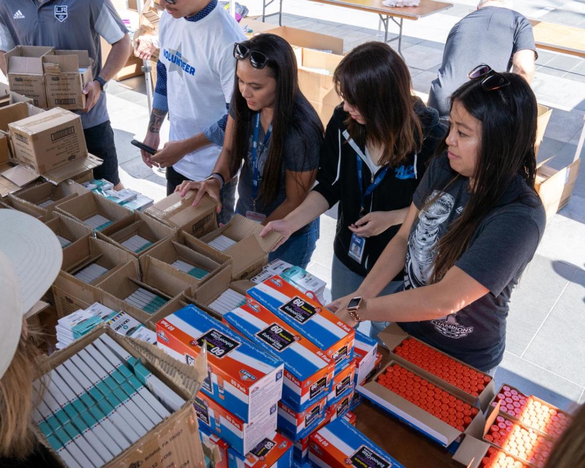 Employees from AEG donated their time to help get students ready for the upcoming school year.